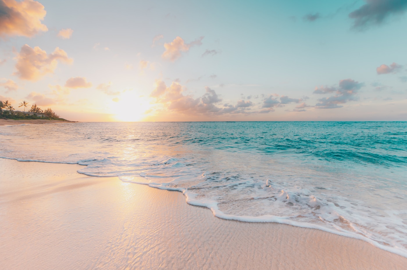 Calm turquoise shoreline at golden hour